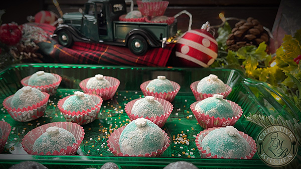 Photo of completed Milky Glitter Teal Snowball Cookies